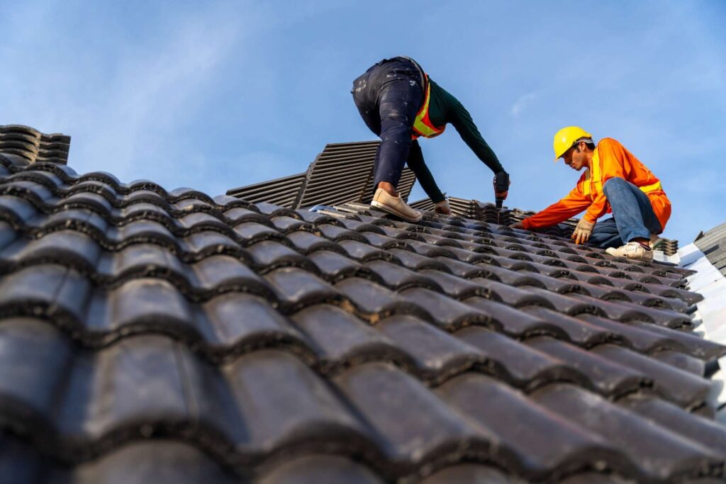 Roofer working on shingles, representing roofing services and web design in Grand Prairie TX